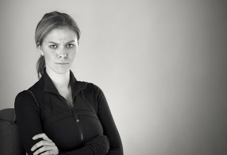 attractive woman on plein background shot in studio with soft lights with an interesting expression and dramatic lighting Black And White, b&wの写真素材