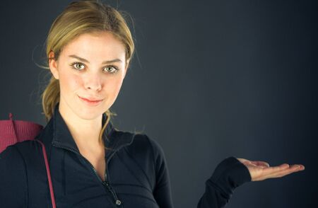 attractive woman on plein background shot in studio with soft lights with an interesting expression and dramatic lightingの写真素材
