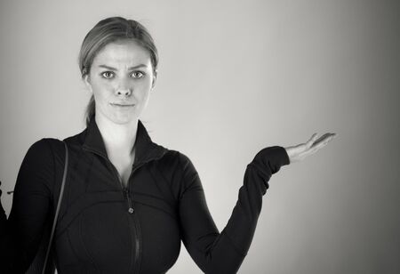 attractive woman on plein background shot in studio with soft lights with an interesting expression and dramatic lighting Black And White, b&wの写真素材