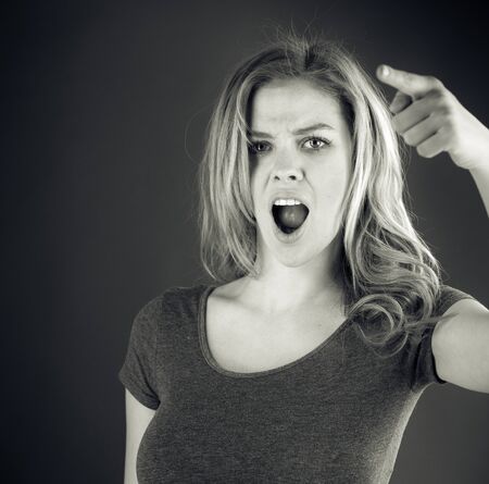 attractive woman on plein background shot in studio with soft lights with an interesting expression and dramatic lighting Black And White, b&wの写真素材