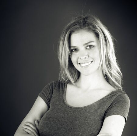 attractive woman on plein background shot in studio with soft lights with an interesting expression and dramatic lighting Black And White, b&wの写真素材
