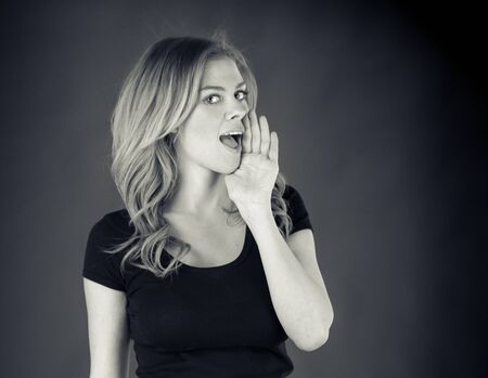 attractive woman on plein background shot in studio with soft lights with an interesting expression and dramatic lighting Black And White, b&wの写真素材