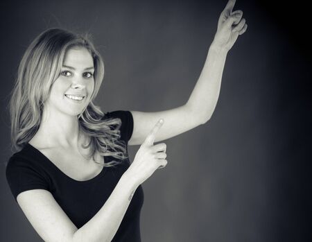 attractive woman on plein background shot in studio with soft lights with an interesting expression and dramatic lighting Black And White, b&wの写真素材