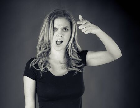 attractive woman on plein background shot in studio with soft lights with an interesting expression and dramatic lighting Black And White, b&wの写真素材