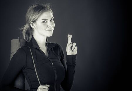 attractive woman on plein background shot in studio with soft lights with an interesting expression and dramatic lighting Black And White, b&wの写真素材