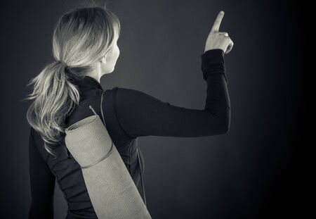 attractive woman on plein background shot in studio with soft lights with an interesting expression and dramatic lighting Black And White, b&wの写真素材