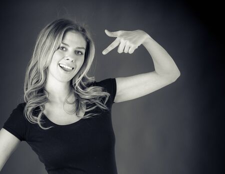 attractive woman on plein background shot in studio with soft lights with an interesting expression and dramatic lighting Black And White, b&wの写真素材