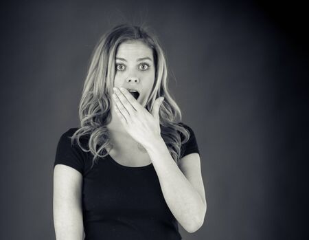 attractive woman on plein background shot in studio with soft lights with an interesting expression and dramatic lighting Black And White, b&wの写真素材
