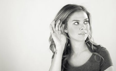 attractive woman on plein background shot in studio with soft lights with an interesting expression and dramatic lighting Black And White, b&wの写真素材