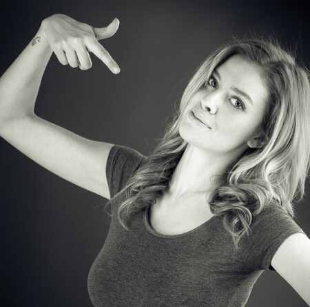 attractive woman on plein background shot in studio with soft lights with an interesting expression and dramatic lighting Black And White, b&wの写真素材