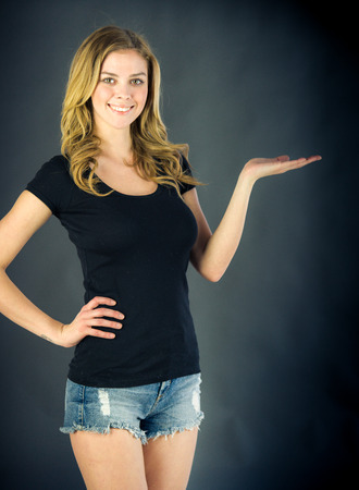 attractive woman on plein background shot in studio with soft lights with an interesting expression and dramatic lightingの写真素材