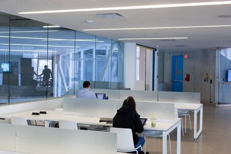 Modern, The Internet, Using Computer, Professional Occupation, Accessibility, Internet, Cooperation, Occupation, Colleague, Computer, Photography, Indoors, Day, Four People, Glass - Material, Illuminated, Ceiling, Light - Natural Phenomenon, Electric Lighのeditorial素材