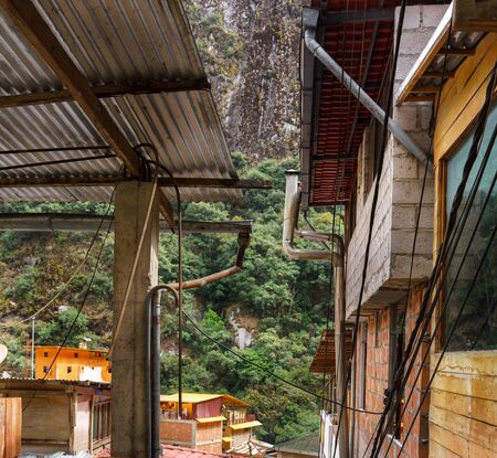 Colour Image, Square, Photography, Day, Outdoors, No People, Mountain, Machu Picchu, Cusco Region, Urubamba Province, Peru, Tourism, Aguas Calientes - Machupicchu District, Travel, Travel Destinations, Cliff, Valley, House, Built Structure, Building Exterの写真素材