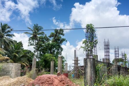 Cloud - Sky, Colour Image, Construction, Construction Frame, Construction Industry, Construction Site, Day, Development, Growth, Horizontal, Incomplete, No People, Outdoors, Palm Tree, Photography, Plant, Power Cable, Sky, Tree, Trinidad - Trinidad And Toの写真素材