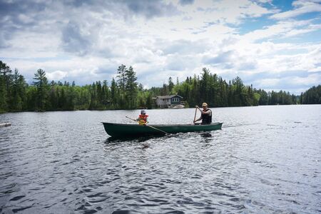 contryside ontario canada nature father and son canoe fishing