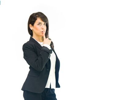 model isolated white background silence finger on lipsの写真素材