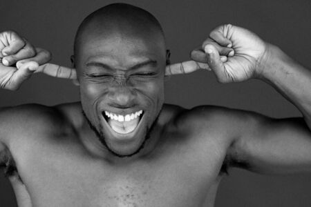 model isolated white background plugging ears too noisyの写真素材
