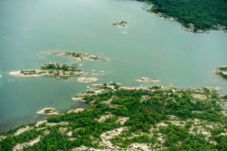 High angle view of coastline with trees and offshore rocks., Toronto, Ontario, Canada. aerial...