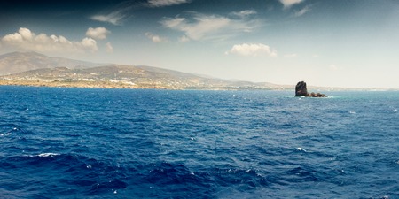 Panoramic view of mountain and sea against sky; Paros; Greeceの写真素材