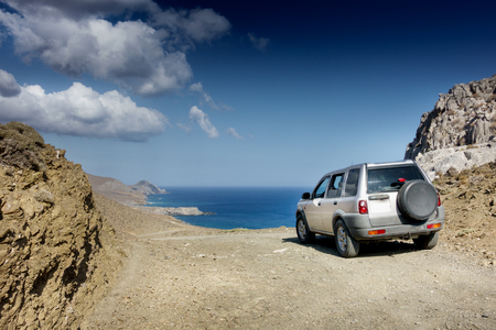 Car against sea; Crete; Greeceの写真素材