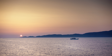 Scenic view of seascape against mountain during sunset; Greeceの写真素材