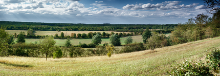 Green field against cloudy sky; Belgiumの写真素材