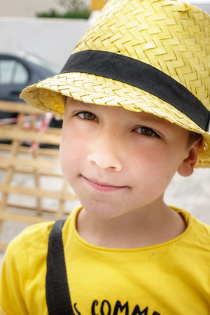 Portrait of boy in sun hatの写真素材