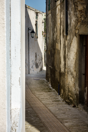 City street amidst building walls Crete Greece Europeの写真素材