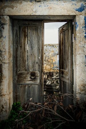 Old door of an abandoned buildingの写真素材