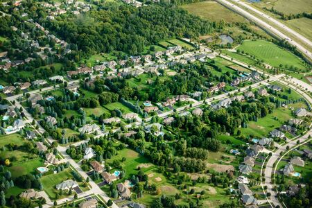 Aerial view of town amidst green landscape, Canadaの写真素材