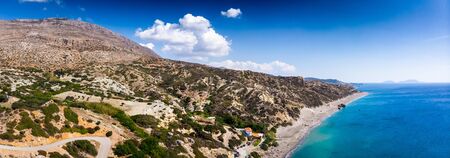 Scenic view of sea and mountain against cloudy sky, Crete, Greeceの写真素材
