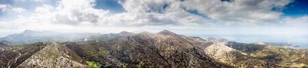 Panoramic view of mountains against skyの写真素材