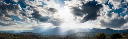Silhouette of agricultural field on mountain against cloudy sky, Crete, Greeceの写真素材