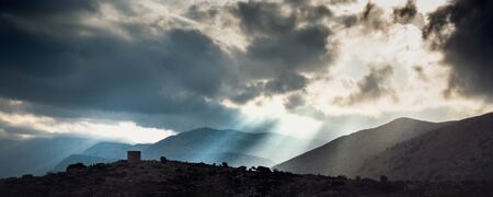 Silhouette of mountain landscape against cloudy sky, Crete, Greece