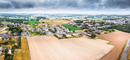 Aerial view of agricultural field and small town at Cancale, Franceの写真素材