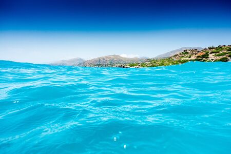 Scenic view of sea by mountain, Crete, Greeceの写真素材