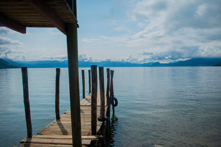 Wooden jetty on lake Atitlan, Guatemala, Central Americaの写真素材