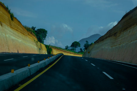 Asphalt road with mountain background in the evening,Thailand.の写真素材