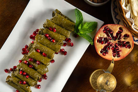 Traditional Middle Eastern food. Lebanese food. Arabian Stuffed Grape Leaves with Pomegranate seeds,...