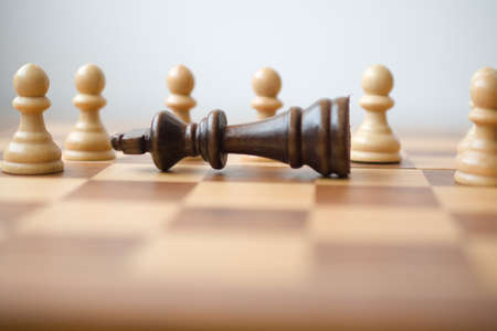 black king defeated, surrounded by some white pawns
