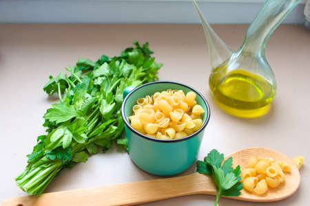 Raw pasta with oil and rosemaryの写真素材