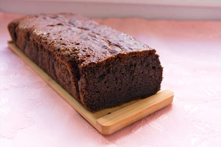 Homemade blueberry cake, over a wooden table and over a pink backgroundの写真素材