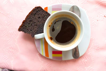 Coffee with a piece of blueberry cakeの写真素材