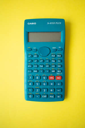 LA CORUÃA, SPAIN - 02-12-2020. A Casio scientific calculator is over a bright yellow background. Science and maths conceptのeditorial素材