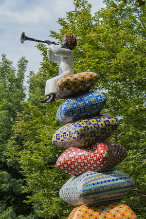 A picture of a sculpture featuring a little girl in the Peizazhna Alley (Kiev).