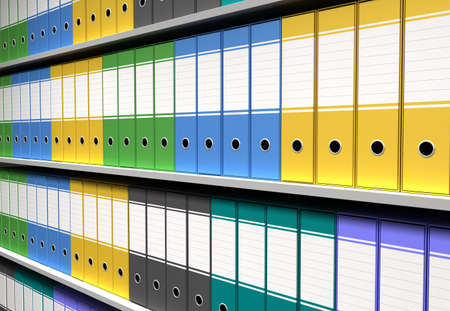 perspective of colorful binders sorted office shelvesの写真素材