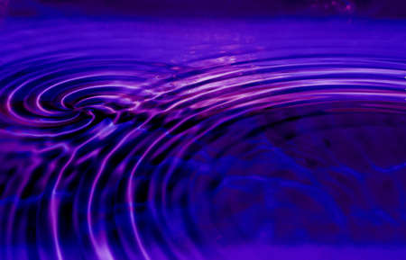 water ripples with a blue backgroundの写真素材