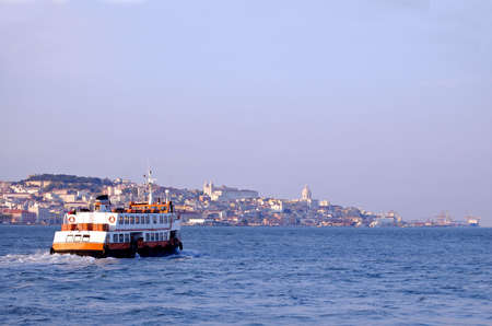 transportation boat "cacilheiro" going to lisbon, people going to work の写真素材