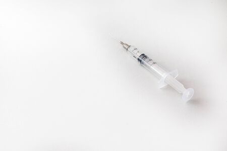 Some syringes and medical needles, hospital equipment used a lot at that time of Covid-19 Pandemic, in several hospitals and health posts.の写真素材