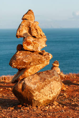 Tower of yellow stones with sand, on the plateau on Madeira Island.